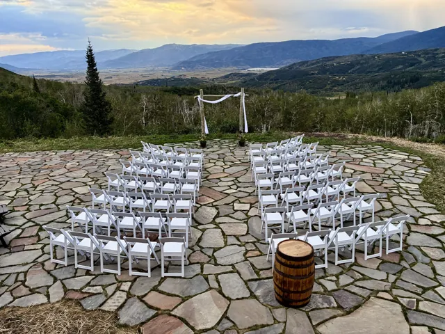 Outdoor ceremony seating on the stone terrace