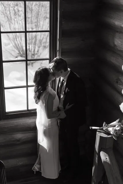 A quiet wedding moment by the window